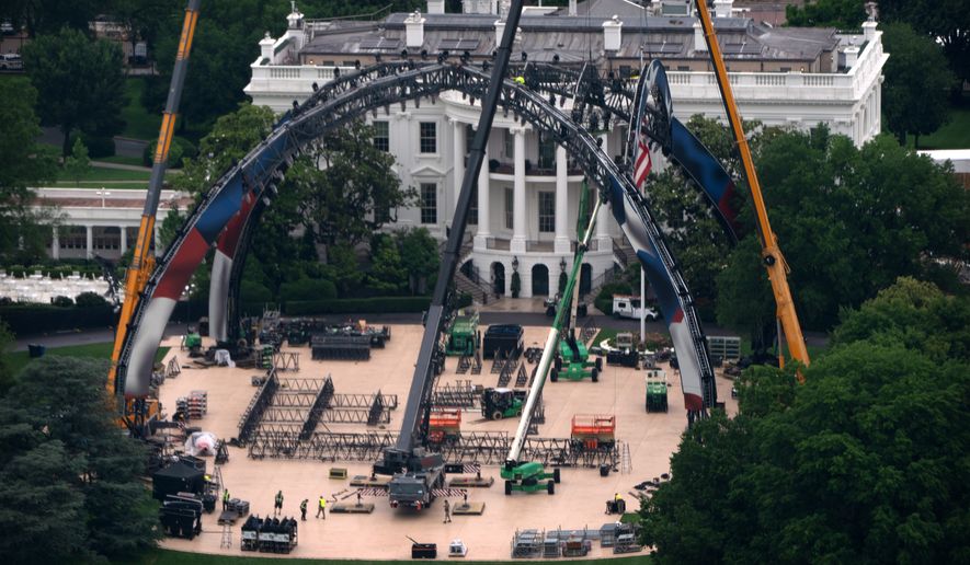 Equipment being placed on the South Lawn of the White House is seen from the Washington Monument, Tuesday, May 26, 2026, in Washington. The UFC is holding a mixed martial arts fight on June 14 as part of America 250 celebrations. (AP Photo/Mark Schiefelbein)