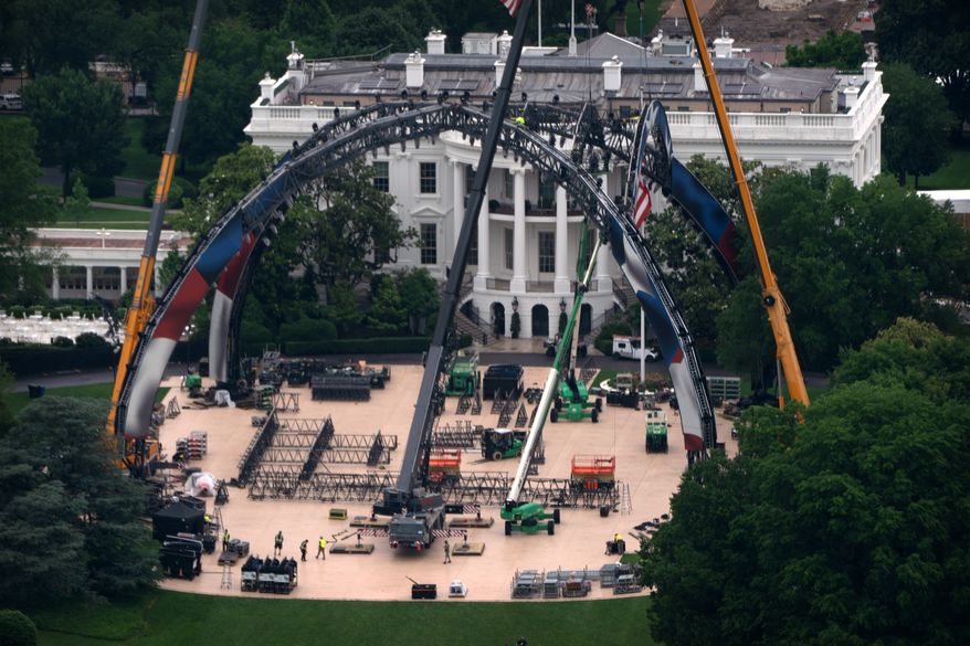 Equipment being placed on the South Lawn of the White House is seen from the Washington Monument, Tuesday, May 26, 2026, in Washington. The UFC is holding a mixed martial arts fight on June 14 as part of America 250 celebrations. (AP Photo/Mark Schiefelbein)