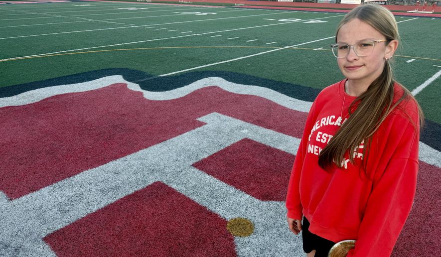 Becky Pepper-Jackson poses on the infield Tuesday, April 7, 2026, at Bridgeport High School in Bridgeport, W.VA. (AP Photo/John Raby)