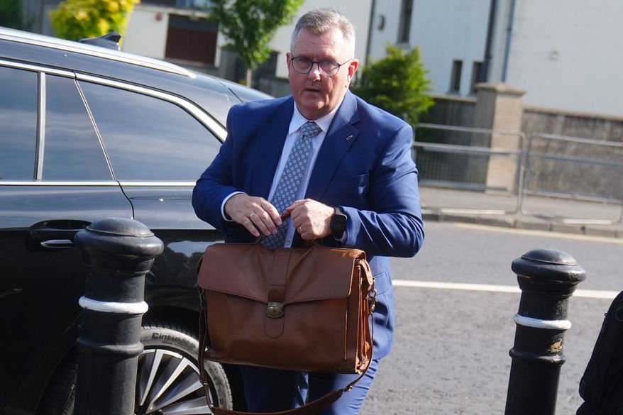 Jeffrey Donaldson arrives at Newry Crown Court, England, where he and his wife Eleanor Donaldson are accused of historical sexual offences, on Wednesday May 27, 2026. (Brian Lawless/PA via AP)