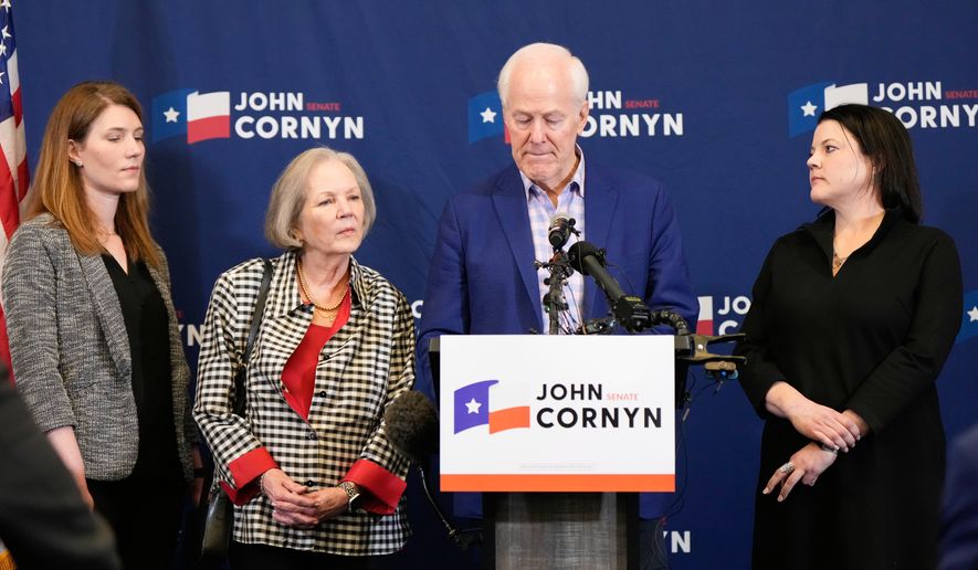 Sen. John Cornyn, R-Texas, center right, speaks alongside, from left, daughter Danley Cornyn, wife Sandy Cornyn and daughter Haley Cornyn, during a primary runoff election night event after losing the Republican party's nomination Tuesday, May 26, 2026, in Austin. (AP Photo/Ashley Landis)