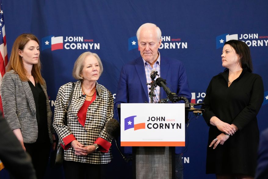 Sen. John Cornyn, R-Texas, center right, speaks alongside, from left, daughter Danley Cornyn, wife Sandy Cornyn and daughter Haley Cornyn, during a primary runoff election night event after losing the Republican party's nomination Tuesday, May 26, 2026, in Austin. (AP Photo/Ashley Landis)