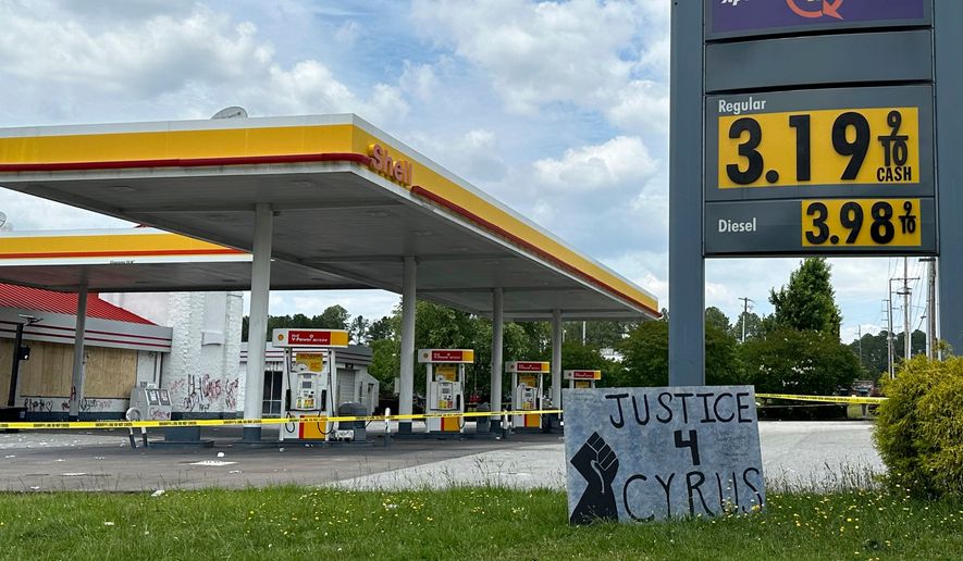 FILE - A sign calling for justice is for Cyrus Carmack-Belton is seen outside a gas station June 1, 2023, in Columbia, S.C. (AP Photo/Jeffrey Collins, File)