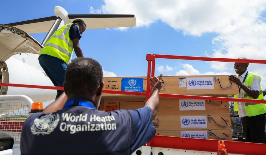 Workers load World Health Organization (WHO) emergency supplies onto a United Nations plane in Nairobi, Kenya, Wednesday, May 20, 2026, headed for Congo to combat the Ebola outbreak in Ituri province. (AP Photo/Andrew Kasuku)