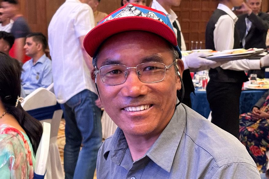 Kami Rita Sherpa, a renowned Mount Everest guide, attends the 'Everest Summiteers Summit' in Kathmandu, Nepal, Wednesday, May 27, 2026. (AP Photo/Upendra Man Singh)