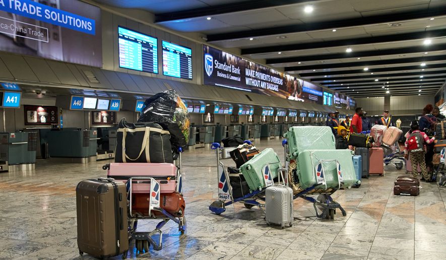 Luggage and personal belongings of Ghanaian nationals awaiting repatriation are lined up near departure counters during preparations for a charter flight from South Africa at O.R. Tambo International Airport in Johannesburg, South Africa, Wednesday, May 27, 2026. (AP Photo/Kayleen Morgan) ** FILE **