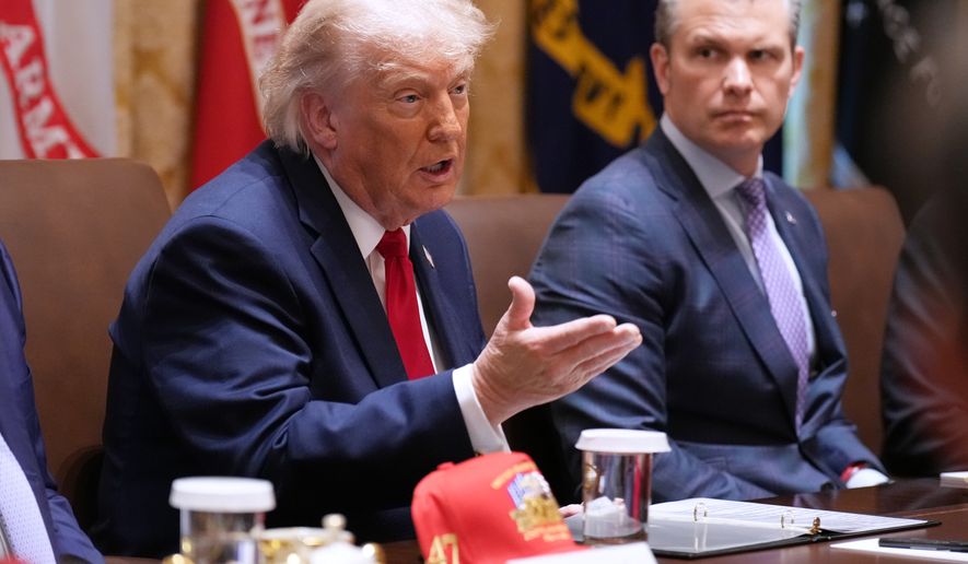 President Donald Trump speaks during a Cabinet meeting at the White House, Wednesday, May 27, 2026, in Washington, as Secretary of Defense Pete Hegseth, looks on. (AP Photo/Jacquelyn Martin)