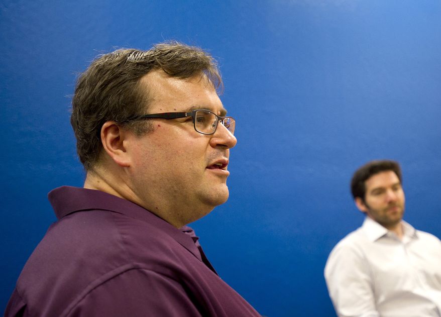LinkedIn co-founder Reid Hoffman discusses the business networking site's performance on Tuesday, May 7, 2013, in Mountain View, Calif. Listening at right is CEO Jeff Weiner. (AP Photo/Noah Berger)