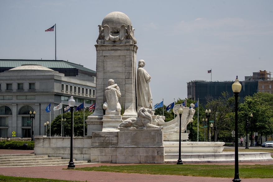 A statue of Christopher Columbus is visible on the Columbus Memorial Fountain in front of Union Station in Washington on Monday, July 6, 2020. (AP Photo/Andrew Harnik) **FILE**