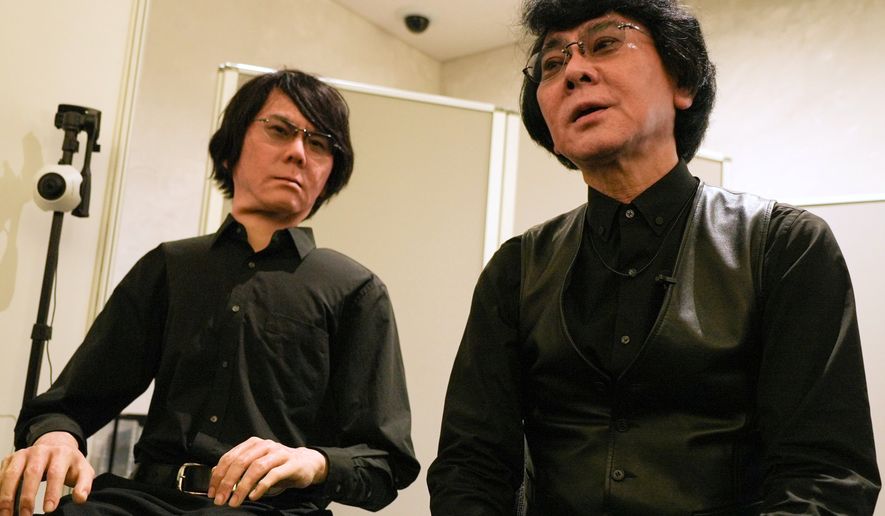 Professor Hiroshi Ishiguro, right, of Osaka University talks to android robot Geminoid at the Humanoids Summit 2026 in Tokyo, Thursday, May 28, 2026. (AP Photo/Ayaka McGill)
