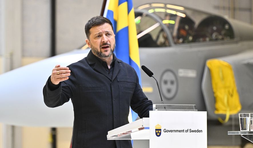 Ukraine's President Volodymyr Zelenskyy and Sweden's Prime Minister Ulf Kristersson, not seen, give a joint news conference at the F16 air flotilla in Uppsala, Sweden, Thursday, May 28, 2026. (Christine Olsson/TT News Agency via AP)