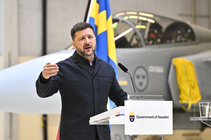 Ukraine's President Volodymyr Zelenskyy and Sweden's Prime Minister Ulf Kristersson, not seen, give a joint news conference at the F16 air flotilla in Uppsala, Sweden, Thursday, May 28, 2026. (Christine Olsson/TT News Agency via AP)