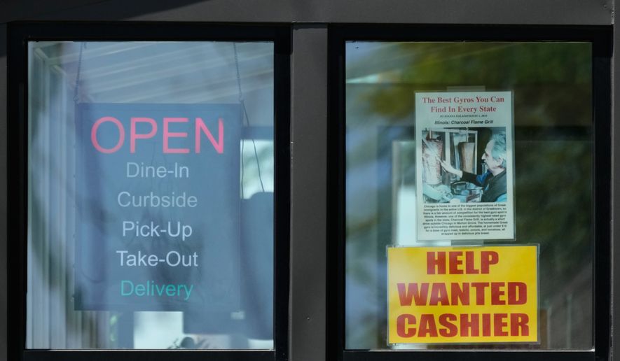 A hiring sign is displayed at a restaurant in Morton Grove, Ill., Thursday, May 14, 2026. (AP Photo/Nam Y. Huh)
