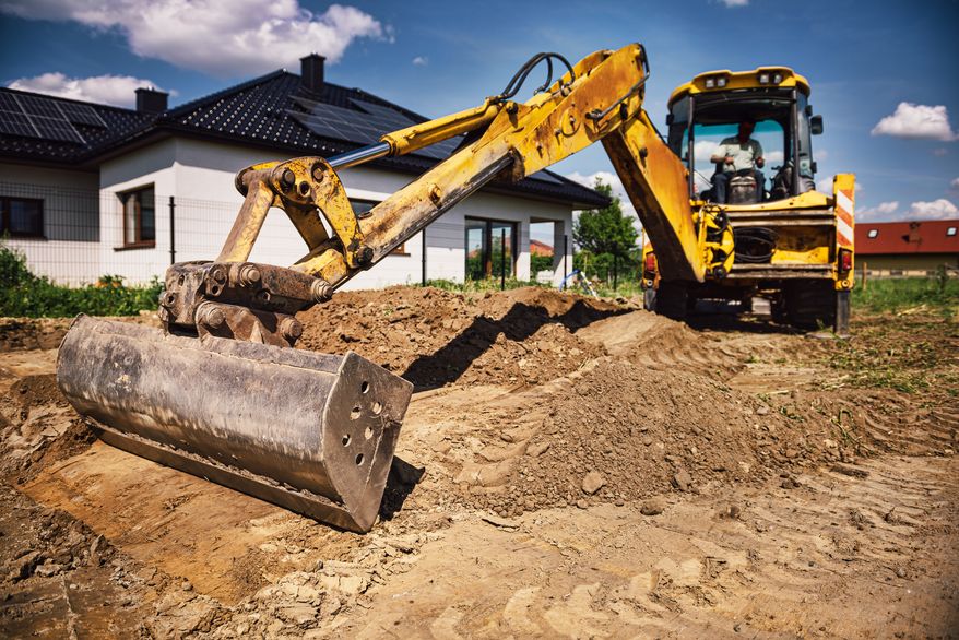 Excavator working at house construction site. File photo credit: Wstockstudio via Shutterstock.