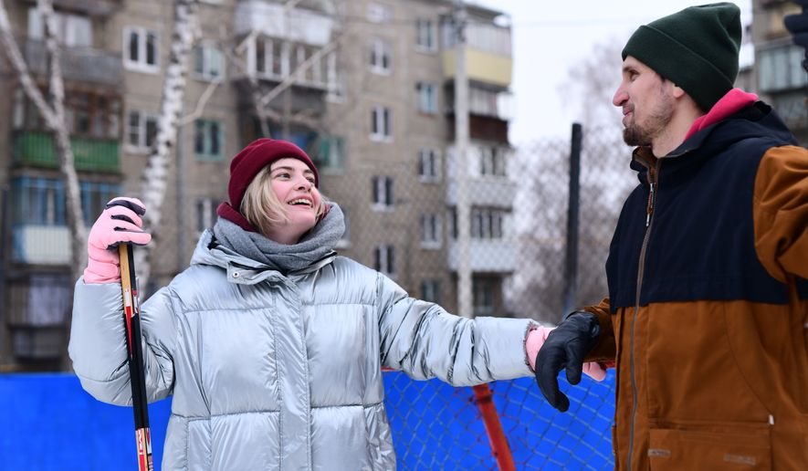 People skate and play ice hockey in the yard. File photo credit: ivan_kislitsin via Shutterstock.