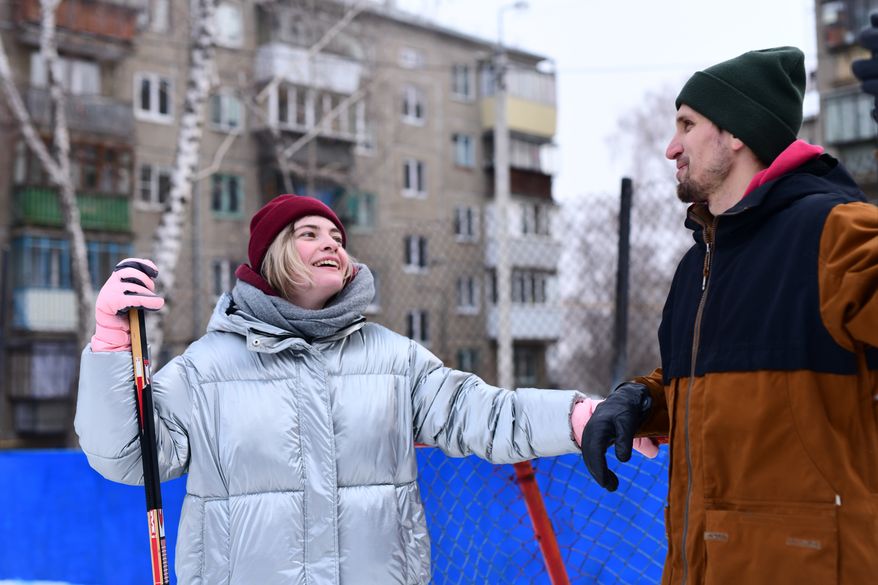 People skate and play ice hockey in the yard. File photo credit: ivan_kislitsin via Shutterstock.