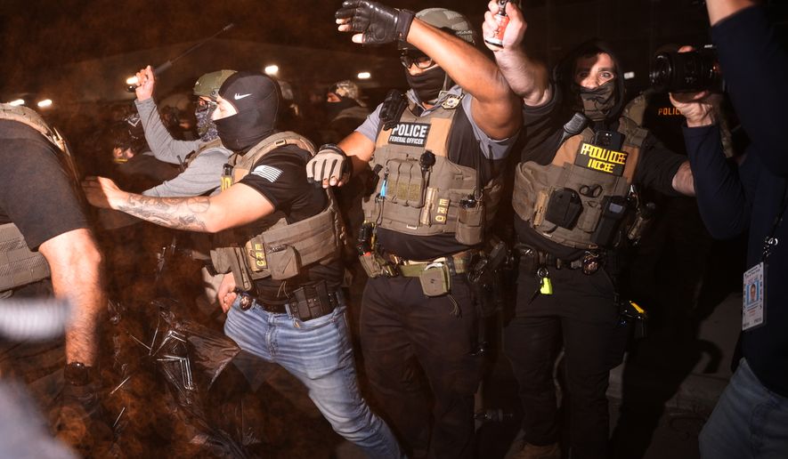 Federal immigration officers pepper spray protesters outside Delaney Hall detention center Thursday, May 28, 2026, in Newark, N.J. (AP Photo/Angelina Katsanis)