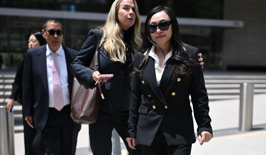 Eileen Wang, the former mayor of Arcadia, Calif., at right, exits federal court after pleading guilty on charges of acting as an illegal agent for the Chinese government on Friday, May 29, 2026, in Los Angeles. (AP Photo/William Liang)