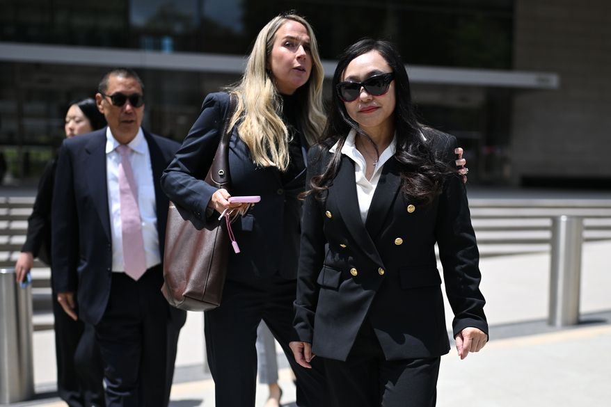 Eileen Wang, the former mayor of Arcadia, Calif., at right, exits federal court after pleading guilty on charges of acting as an illegal agent for the Chinese government on Friday, May 29, 2026, in Los Angeles. (AP Photo/William Liang)