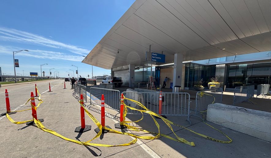 Police tape surrounds the site where a driver crashed his vehicle into the Evans Terminal at Detroit Metropolitan Airport in Romulus, Mich., on Friday, May 29, 2026. (Fuad Shalhout/MLive.com via AP)