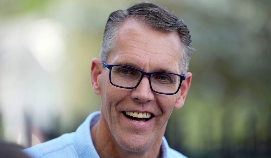 Rep. Randy Feenstra, R-Iowa, campaigns for the Republican nomination for governor during a rally with local residents, Wednesday, May 27, 2026, in West Des Moines, Iowa. (AP Photo/Charlie Neibergall)
