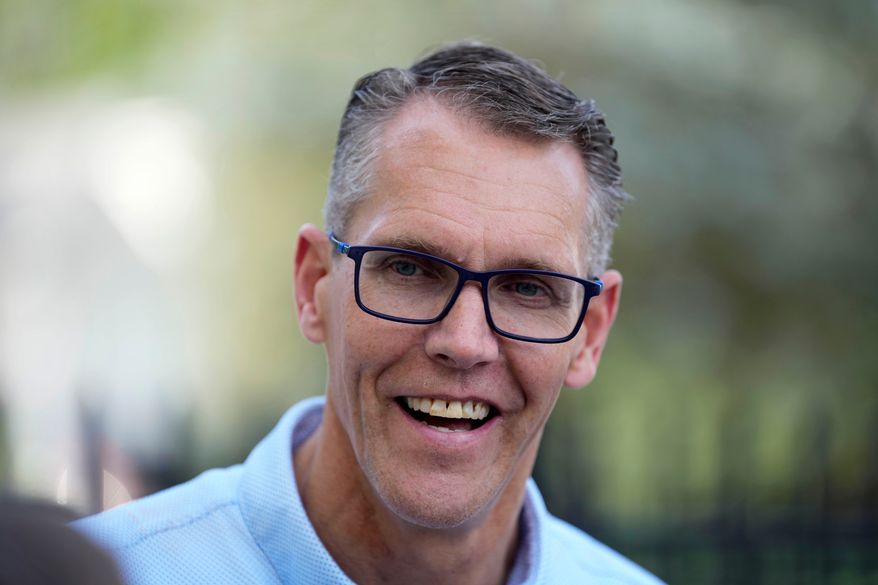 Rep. Randy Feenstra, R-Iowa, campaigns for the Republican nomination for governor during a rally with local residents, Wednesday, May 27, 2026, in West Des Moines, Iowa. (AP Photo/Charlie Neibergall)