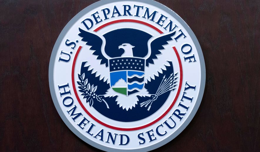 The seal of U.S. Department of Homeland Security is seen before a news conference at ICE Headquarters in Washington, May 21, 2025. (AP Photo/Jose Luis Magana, File)