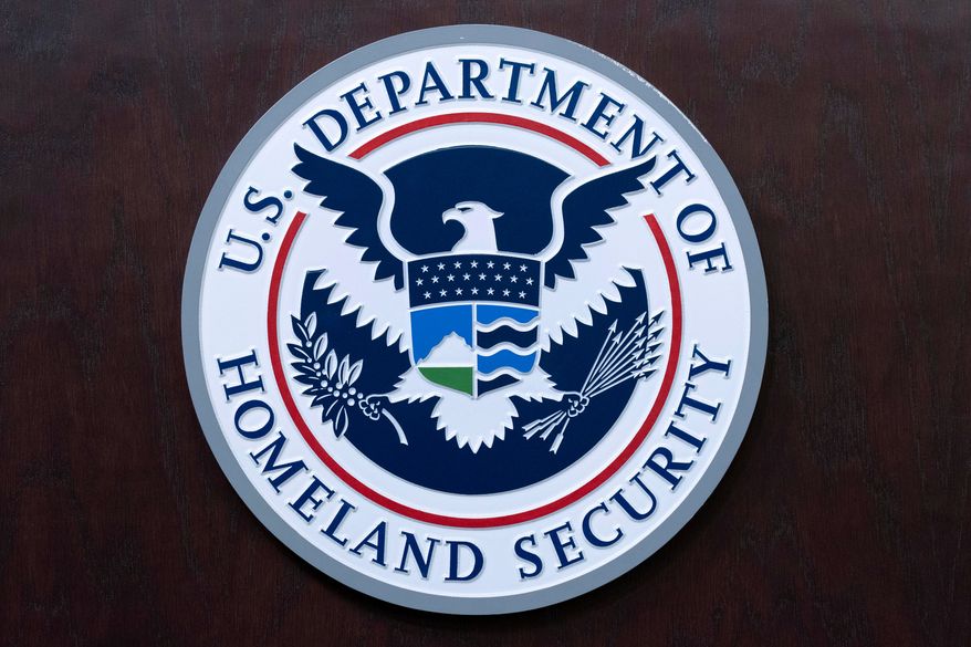 The seal of U.S. Department of Homeland Security is seen before a news conference at ICE Headquarters in Washington, May 21, 2025. (AP Photo/Jose Luis Magana, File)