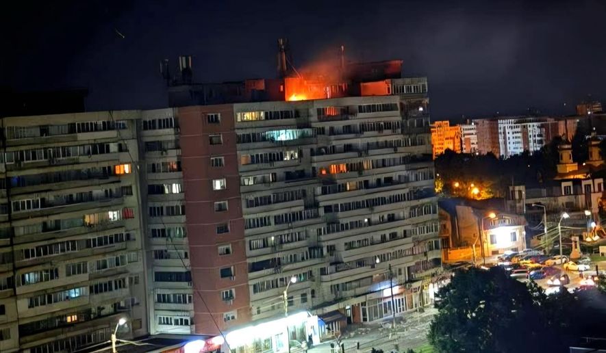 This photo released by Romania's Department for Emergency Situations shows a fire on top of a block of flats after a drone crash caused an explosion and fire on impact, in Galati, eastern Romania near the Ukrainian border, Friday May 29, 2026. (ISU Galati via AP)