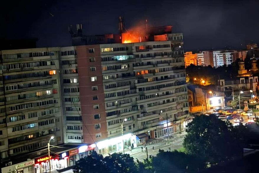 This photo released by Romania's Department for Emergency Situations shows a fire on top of a block of flats after a drone crash caused an explosion and fire on impact, in Galati, eastern Romania near the Ukrainian border, Friday May 29, 2026. (ISU Galati via AP)