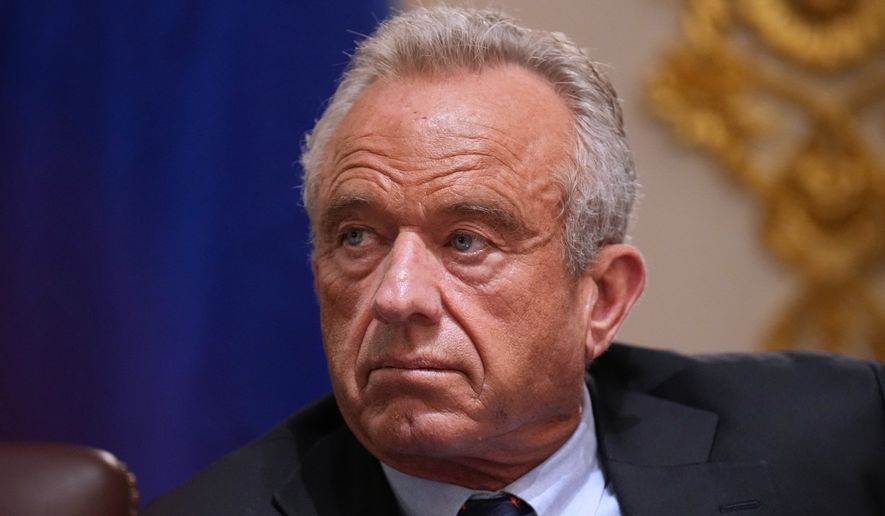Secretary of Health and Human Services Robert F. Kennedy Jr., listens during a Cabinet meeting at the White House, Wednesday, May 27, 2026, in Washington. (AP Photo/Jacquelyn Martin)