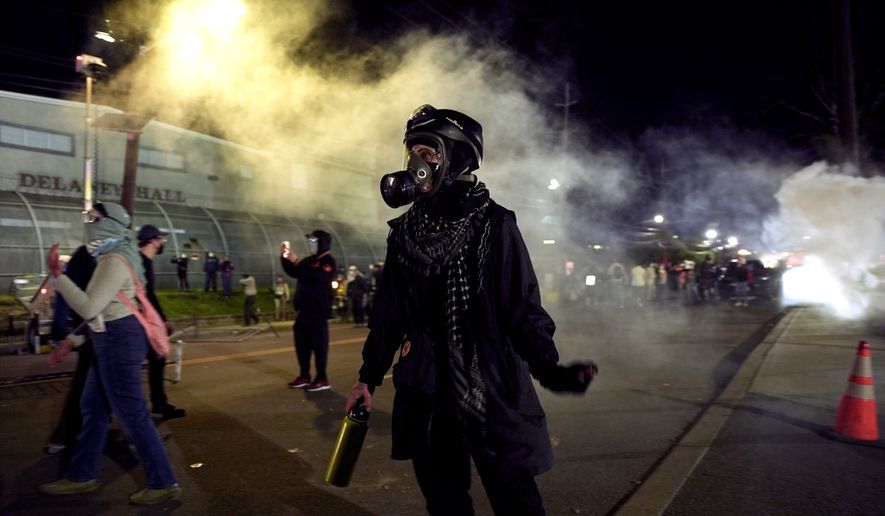 Anti-ICE protesters take to the streets during clashes with law enforcement outside the Delaney Hall detention center on Saturday, May 30, 2026, in Newark, N.J. (AP Photo/Angelina Katsanis)