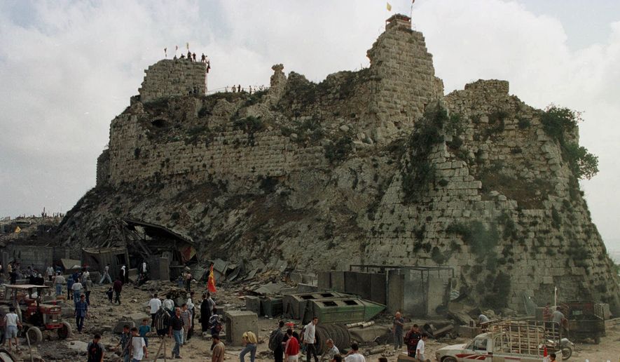 Villagers inspect the damage to Beaufort Castle, 6 miles northwest of the southern market town of Nabatiyeh, Lebanon, Wednesday, May 24, 2000. (AP Photo/Ahmed Mantash, File)