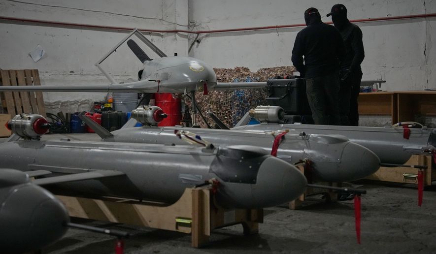 Servicemen of Ukraine's defense intelligence set up drones against Russian in an undisclosed location in Ukraine late Thursday, May 28, 2026. (AP Photo/Efrem Lukatsky)