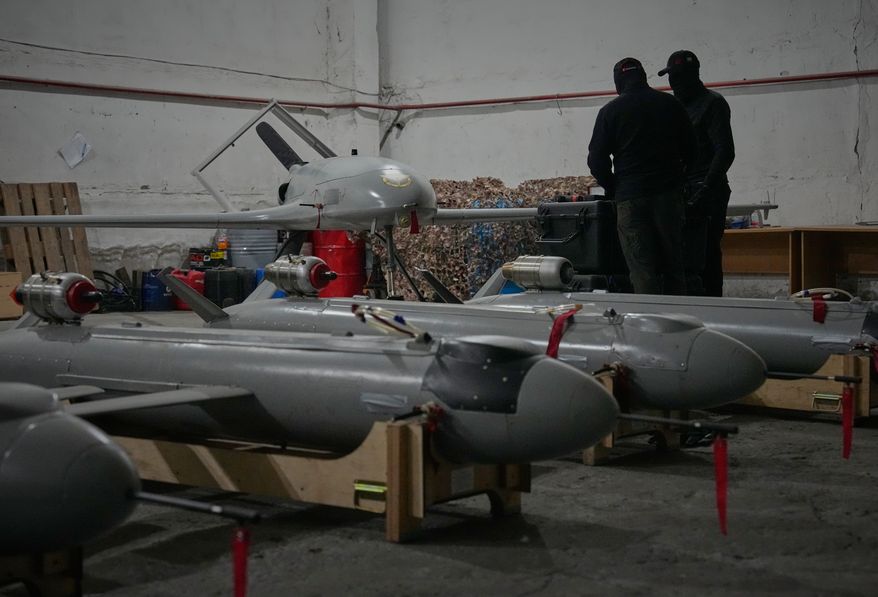 Servicemen of Ukraine's defense intelligence set up drones against Russian in an undisclosed location in Ukraine late Thursday, May 28, 2026. (AP Photo/Efrem Lukatsky)