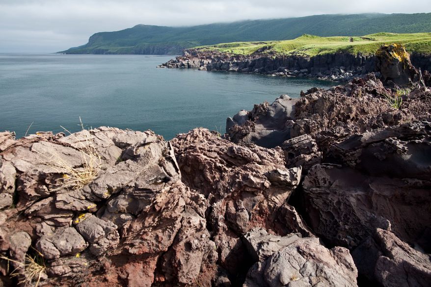 In this Sunday, Aug. 21, 2011 photo lava-sediment of Bogdan Khelmintsky Volcano seen in Iturup Island, Russian Far East. (AP Photo/Sergei Krasnoukhov)