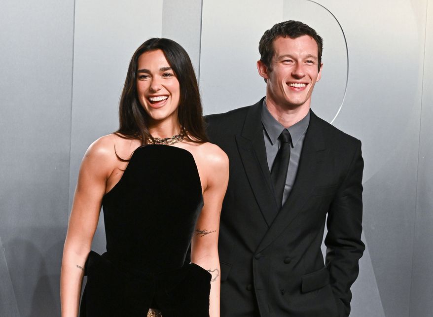 Dua Lipa, left, and Callum Turner arrive at the Vanity Fair Oscar Party on Sunday, March 15, 2026, at the Los Angeles County Museum of Art in Los Angeles. (Photo by Evan Agostini/Invision/AP, File)