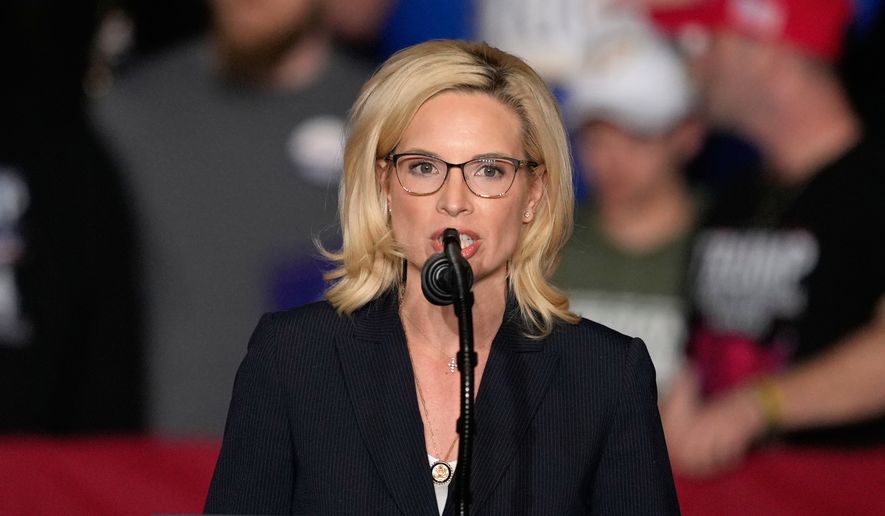 Rep. Ashley Hinson, R-Iowa, speaks before President Donald Trump arrives at a rally, Jan. 27, 2026, in Clive, Iowa. (AP Photo/Charlie Neibergall, File)