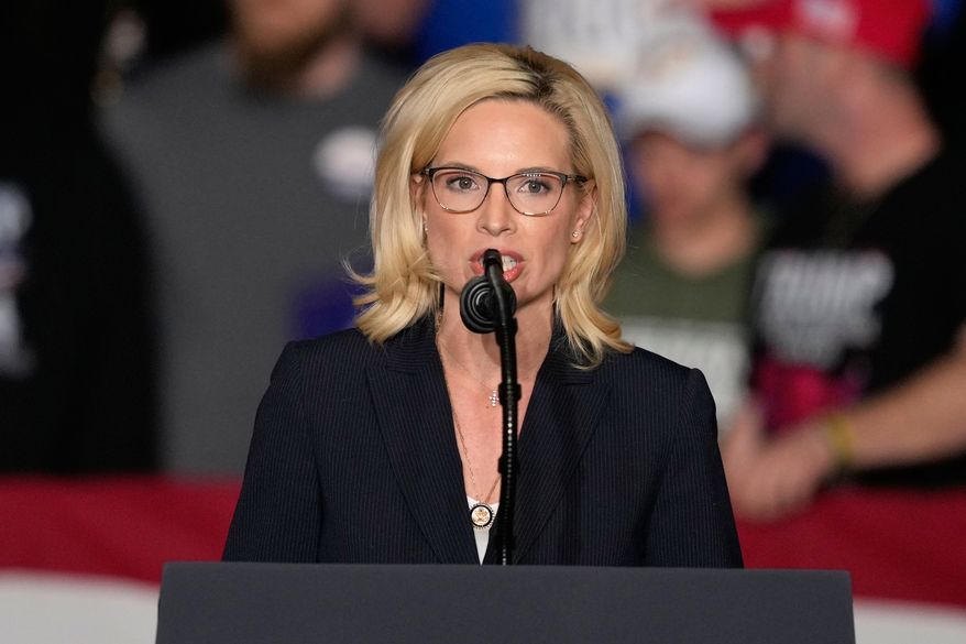 Rep. Ashley Hinson, R-Iowa, speaks before President Donald Trump arrives at a rally, Jan. 27, 2026, in Clive, Iowa. (AP Photo/Charlie Neibergall, File)
