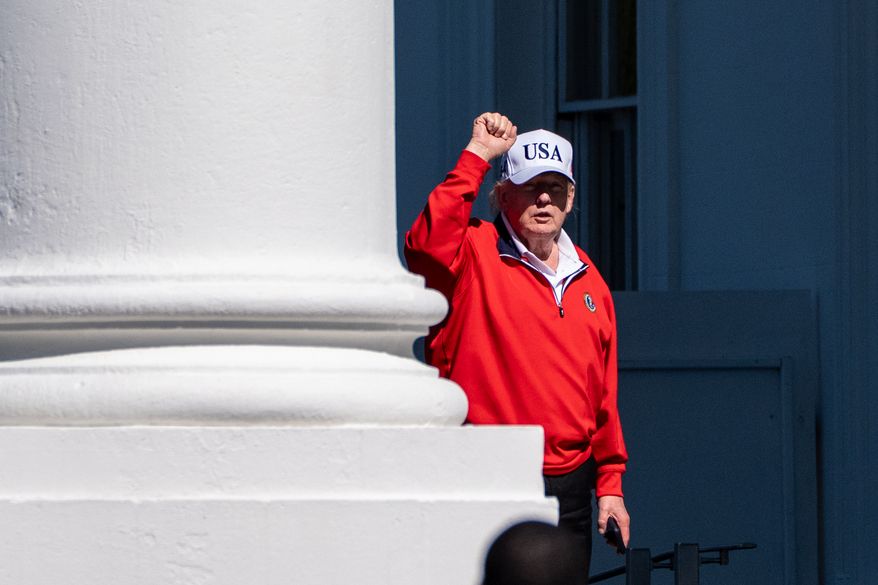 President Donald Trump pumps his fist as he arrives at the White House, Sunday, May 31, 2026, in Washington. (AP Photo/Alex Brandon)