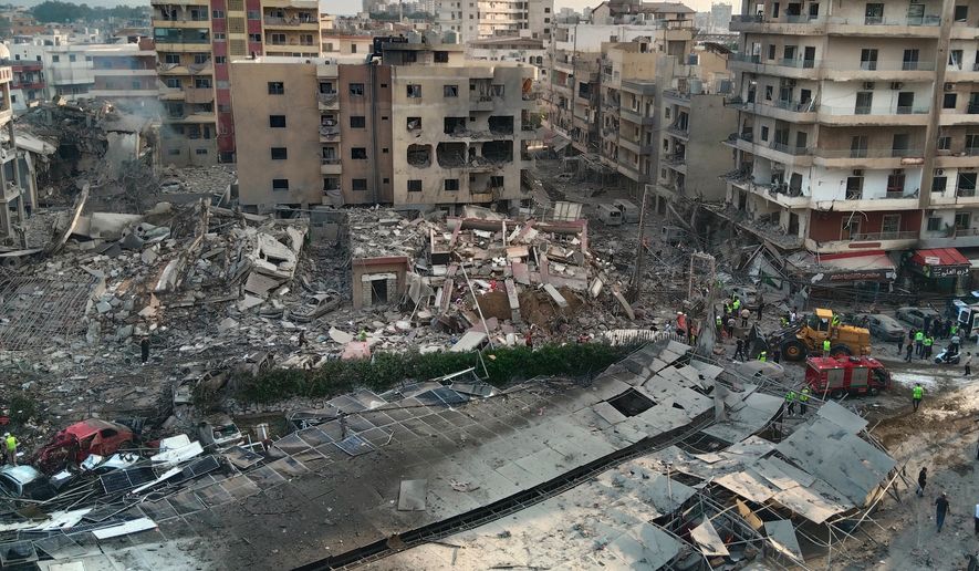 Rescuers work at the site of an Israeli airstrike that hit a building and damaged a hospital in the southern port city of Tyre, Lebanon, Monday, June 1, 2026. (AP Photo)