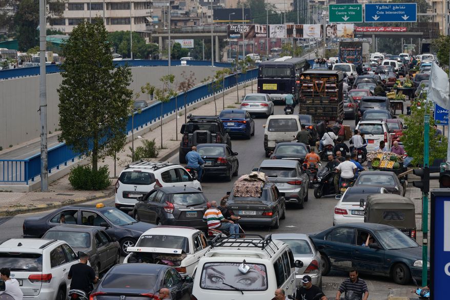 Cars sit in traffic on a highway as residents flee following an Israeli threat to strike Dahiyeh, Beirut's southern suburbs, Lebanon, Monday, June 1, 2026. (AP Photo/Bilal Hussein)