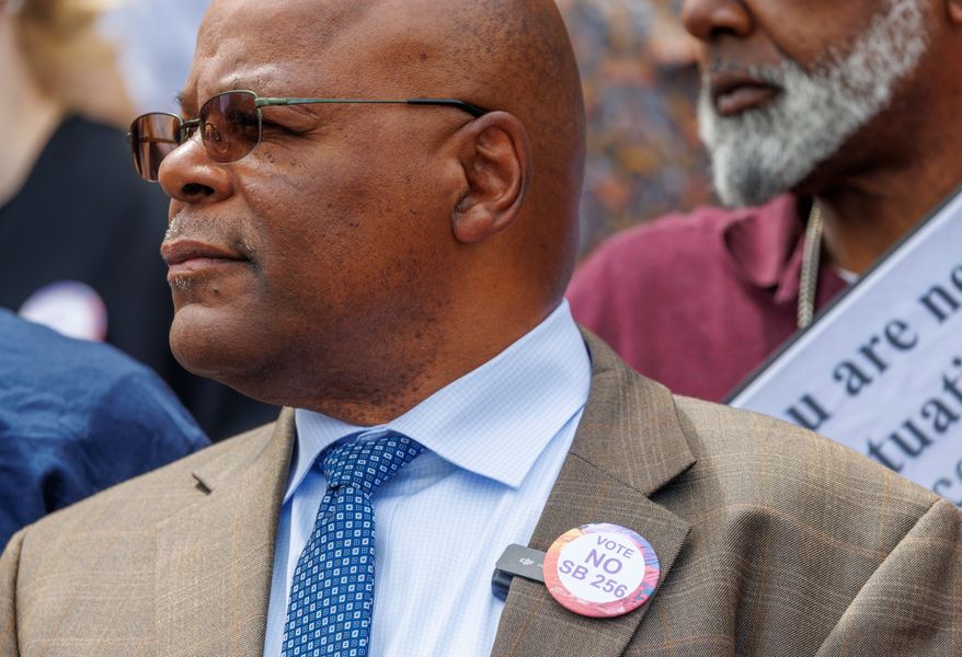 Calvin Duncan, wearing a button signifying his disagreement with Louisiana Senate Bill 256, is sworn in as the new clerk on April 21, 2026, on the steps of the Orleans Parish Criminal District Courthouse in New Orleans. (Chris Granger/The Times-Picayune/The New Orleans Advocate via AP)