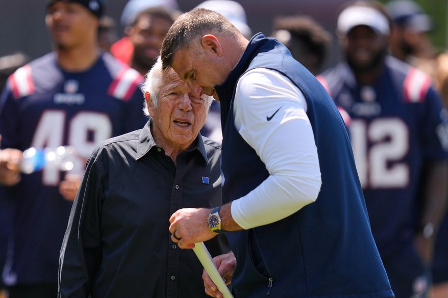 New England Patriots owner Robert Kraft talks with head coach Mike Vrabel during a community NFL football day, Wednesday, May 20, 2026, in Foxborough, Mass. (AP Photo/Charles Krupa)
