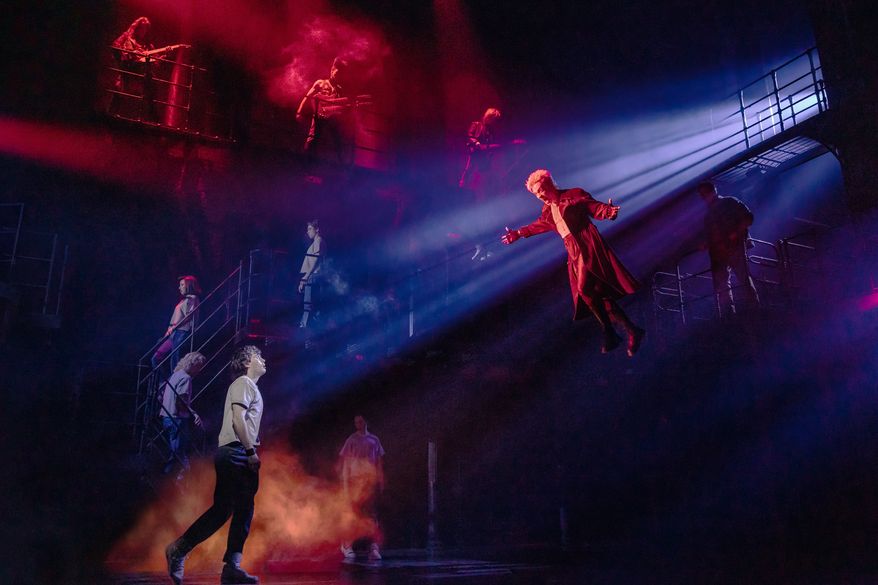L.J. Benet, foreground left, and Ali Louis Bourzgui, suspended right, appear with the Broadway cast of "The Lost Boys" during a performance in New York on March 25, 2026. (Matthew Murphy via AP)