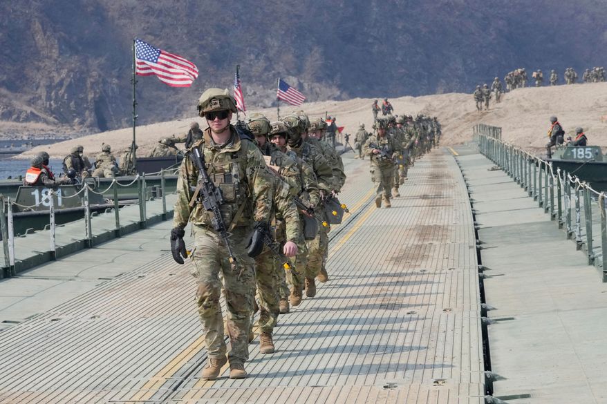 U.S. Army soldiers cross a floating bridge on the Imjin River during a joint river-crossing exercise between South Korea and the United States as a part of the Freedom Shield military exercise in Yeoncheon, South Korea, March 20, 2025. (AP Photo/Ahn Young-joon, File)
