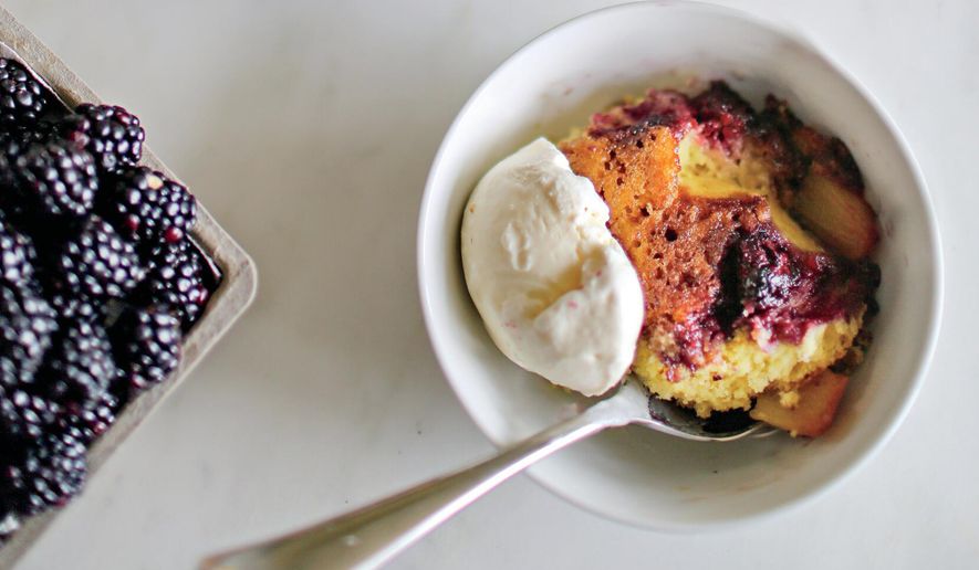 This image released by Voracious shows a recipe for cast-iron fruit cake from the cookbook “The Seasoned Life” by Ayesha Curry. (Caroline Egan/Voracious via AP)