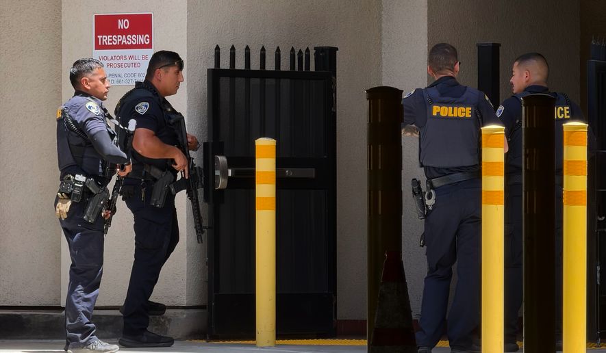 Police officers respond after a man barricaded himself inside a bank on Tuesday, June 2, 2026, in Bakersfield, Calif. (Jacob, Dad’s Gone Live via AP)