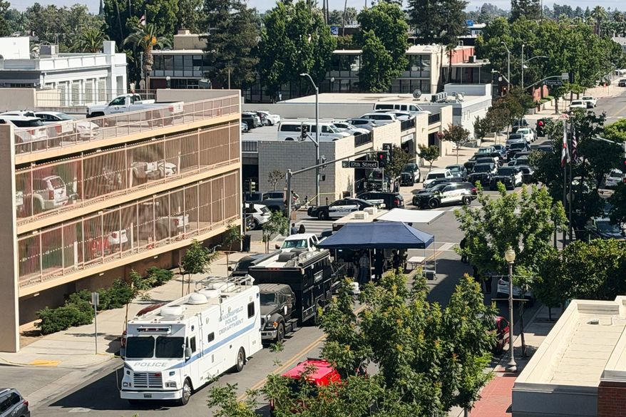 An overhead view shows the scene of a standoff after a man barricaded himself inside a bank on Tuesday, June 2, 2026 in Bakersfield, Calif. (Jacob, Dad’s Gone Live via AP)