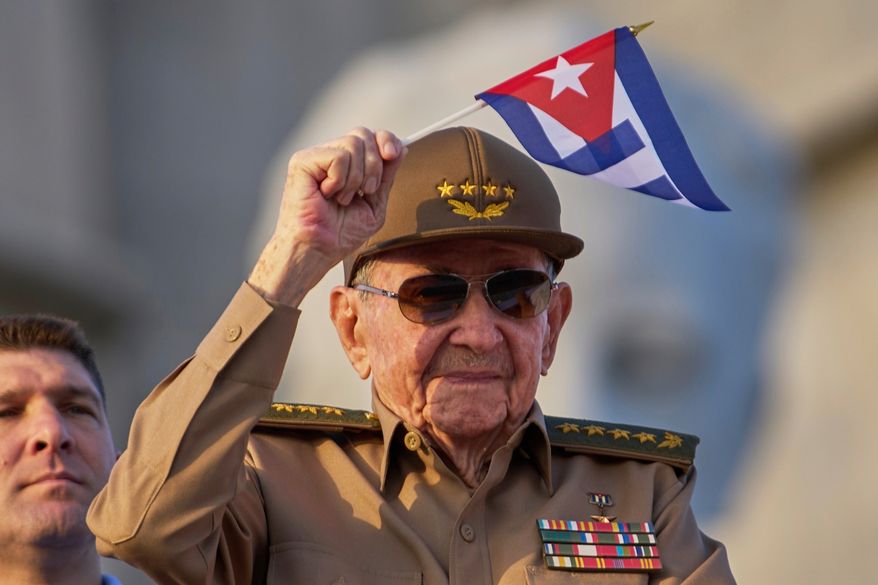 FILE - Raul Castro waves a Cuban national flag during a May Day parade at Revolution Square in Havana, May 1, 2025. (AP Photo/Ramon Espinosa, File)